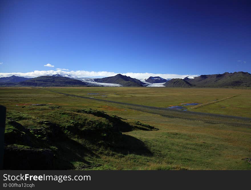 Over the green fields to the glacier Iceland