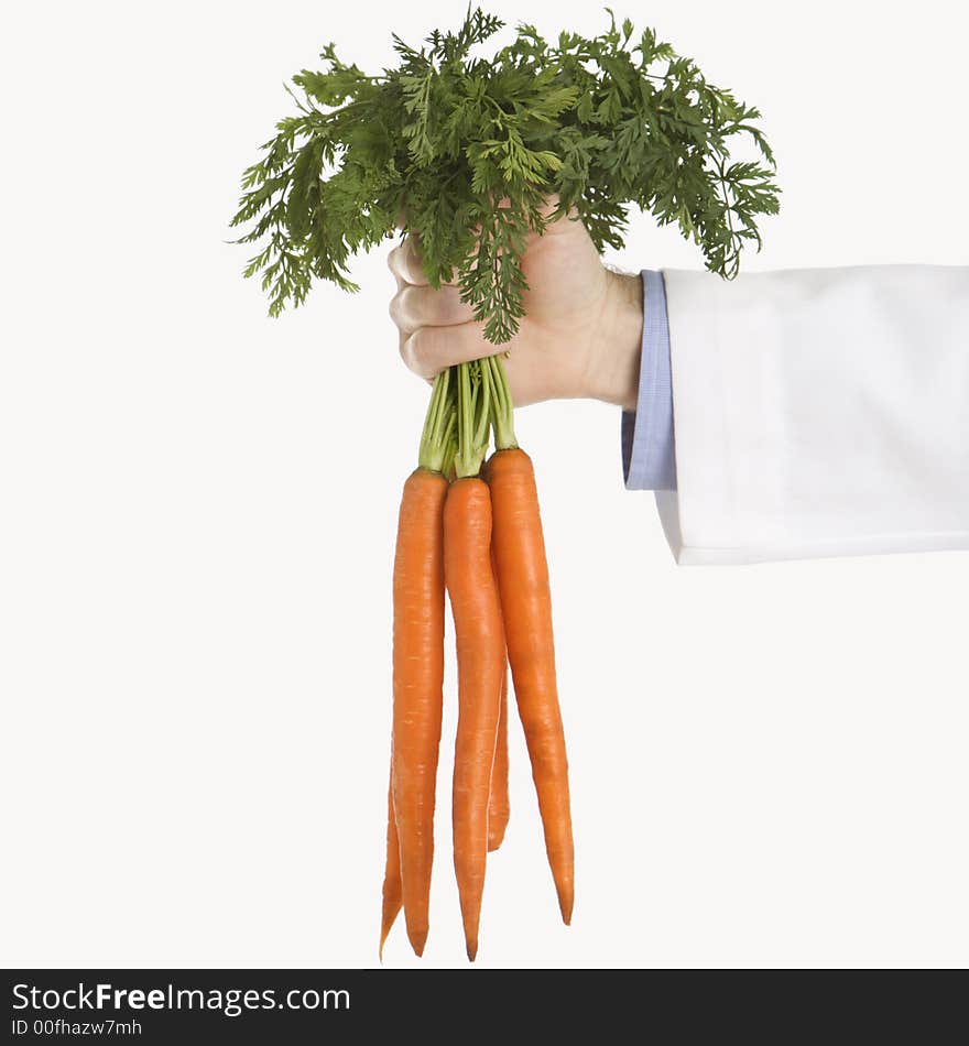 Doctor holding carrots