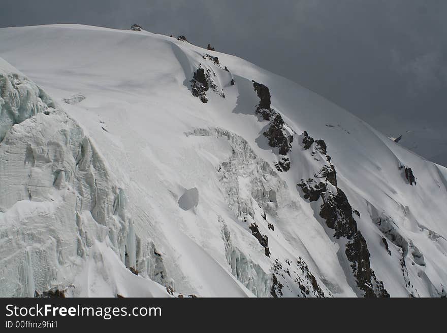 Mountain ridge and the dark sky. Mountain ridge and the dark sky