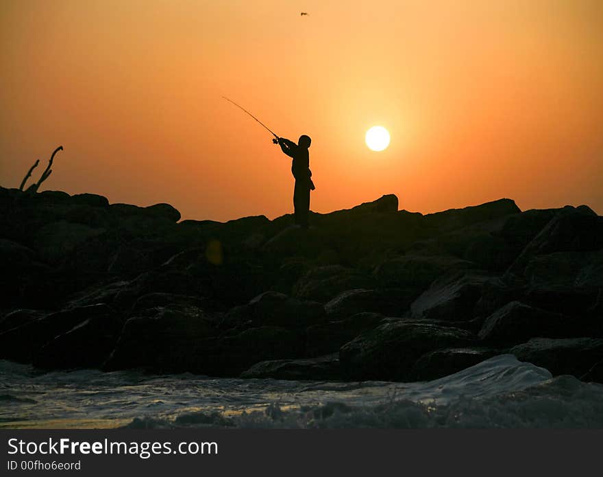 Lone fisherman at the beach in ventura California. Lone fisherman at the beach in ventura California