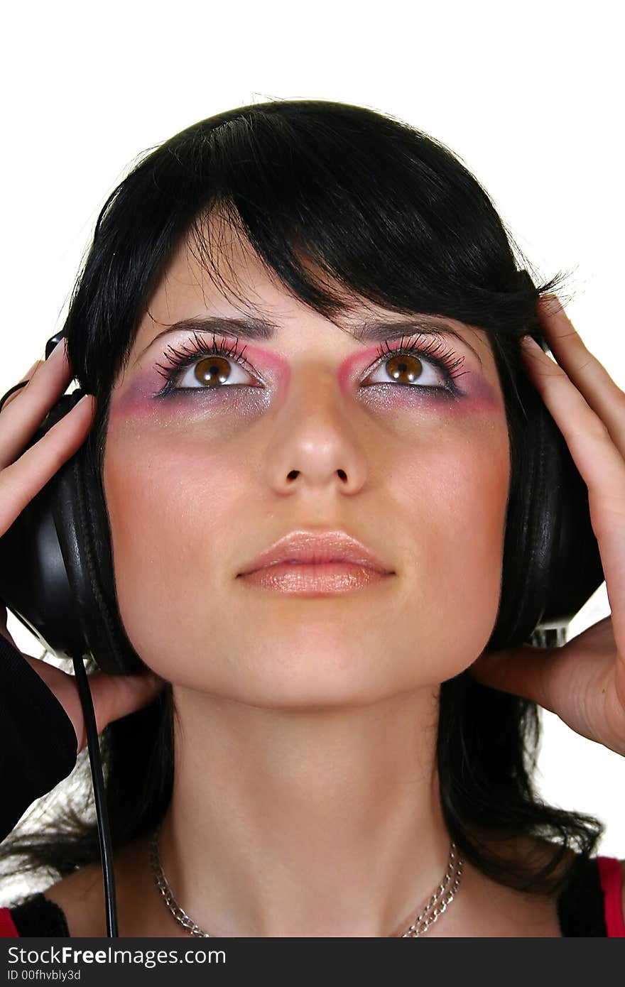 Beautiful brunette girl listening music, isolated on white background. Beautiful brunette girl listening music, isolated on white background