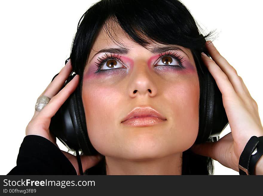 Beautiful brunette girl listening music, isolated on white background. Beautiful brunette girl listening music, isolated on white background