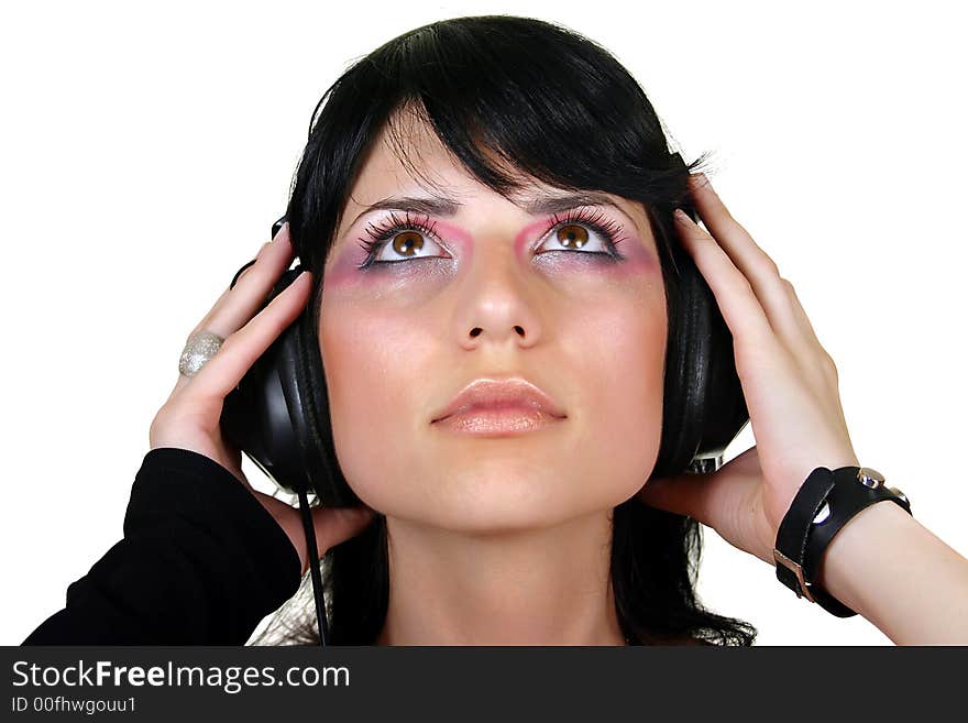 Beautiful brunette girl listening music, isolated on white background