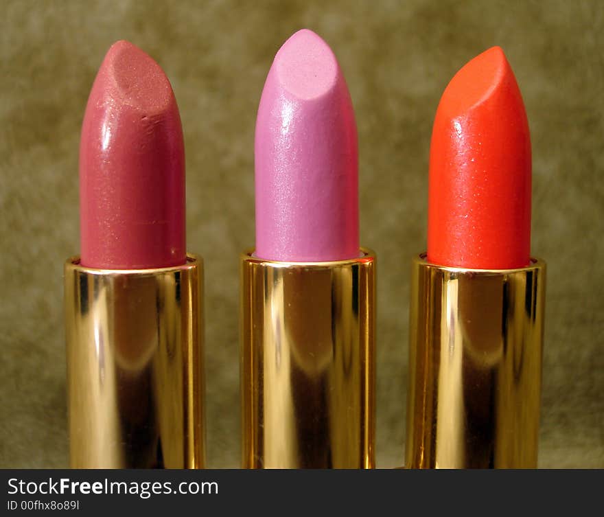 Three colored lipsticks