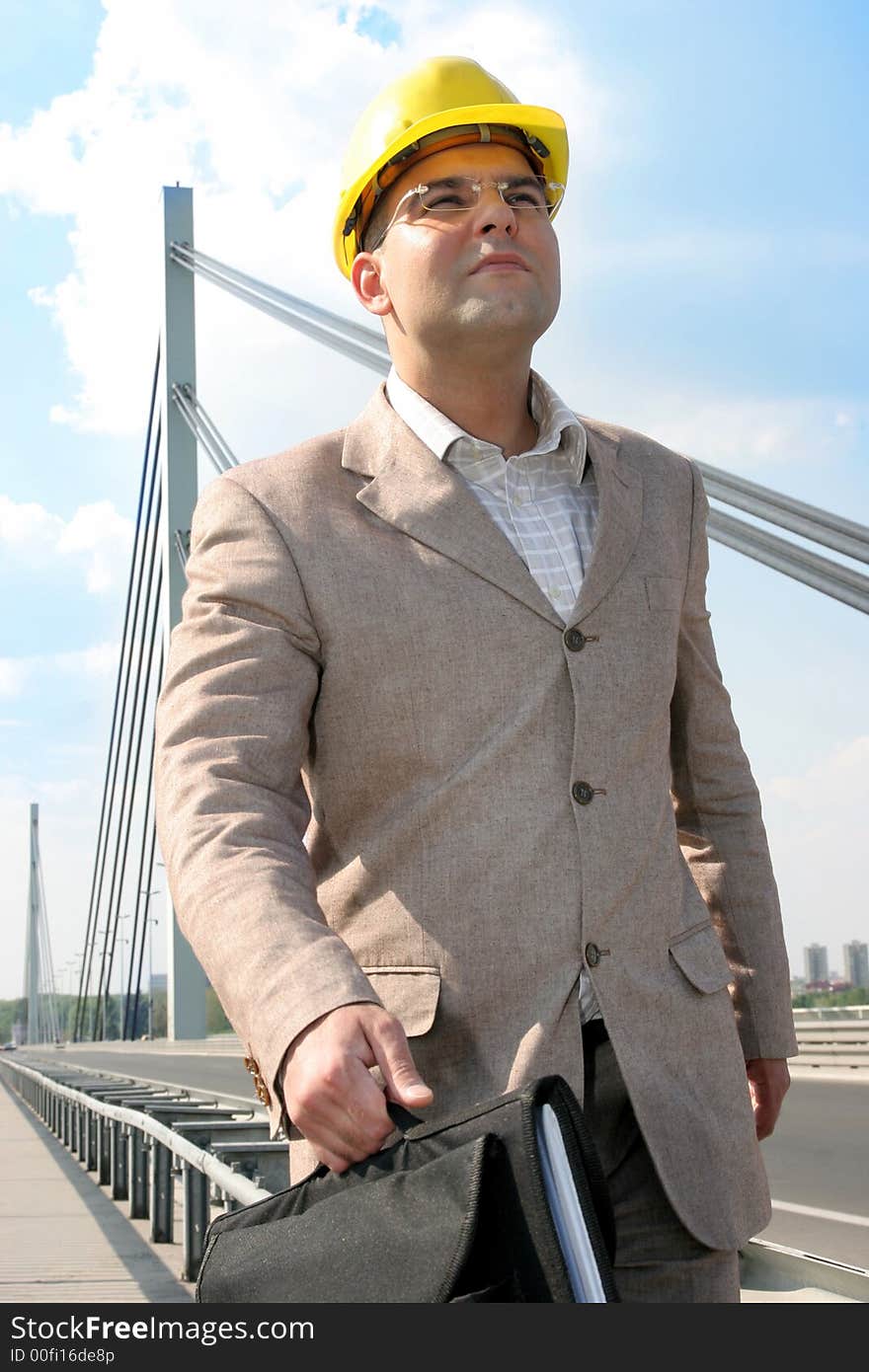 Businessman walking to work over bridge