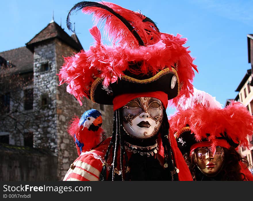 A Couple wearing Venetian Mask with Medieval Background. A Couple wearing Venetian Mask with Medieval Background