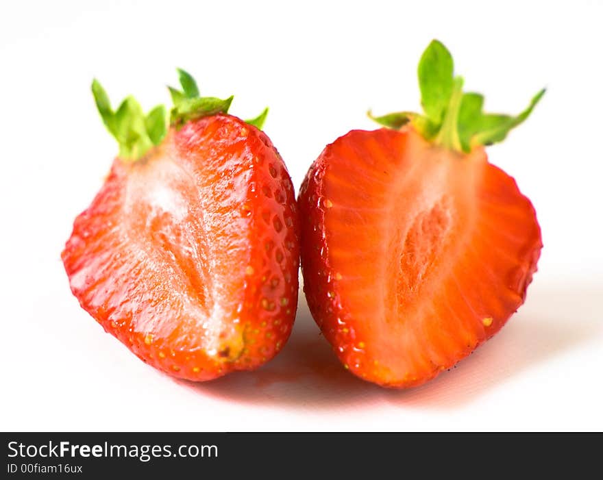 Segments of a fresh juicy ripe strawberry. Segments of a fresh juicy ripe strawberry