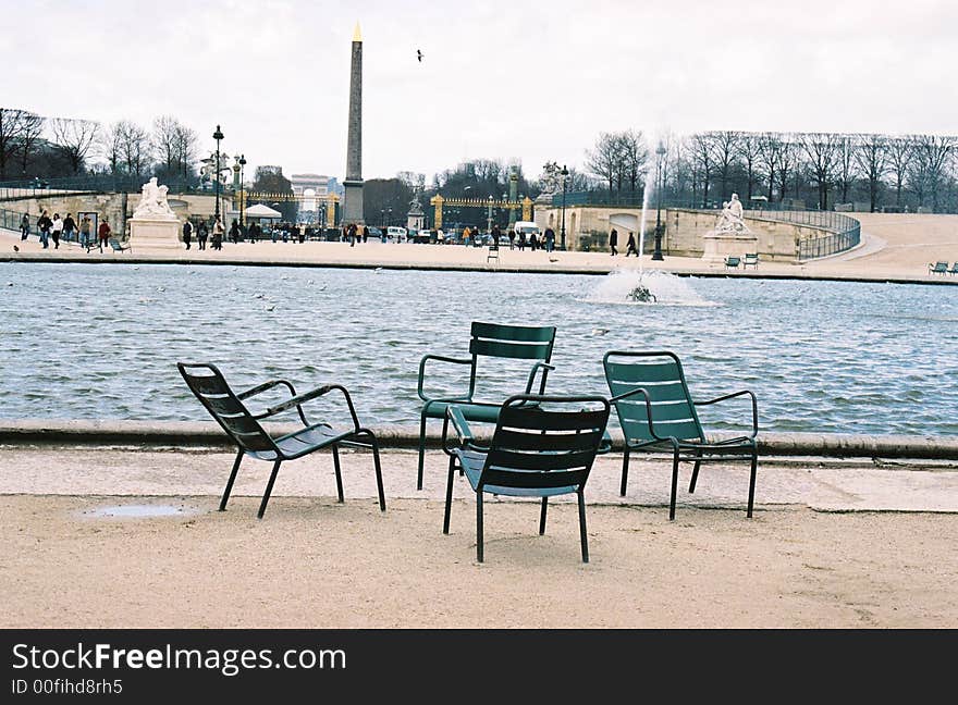 Four empty chairs in paris square