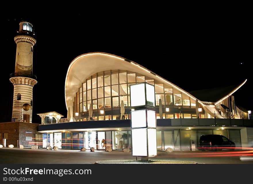 Lighthouse restaurant at night by seaside