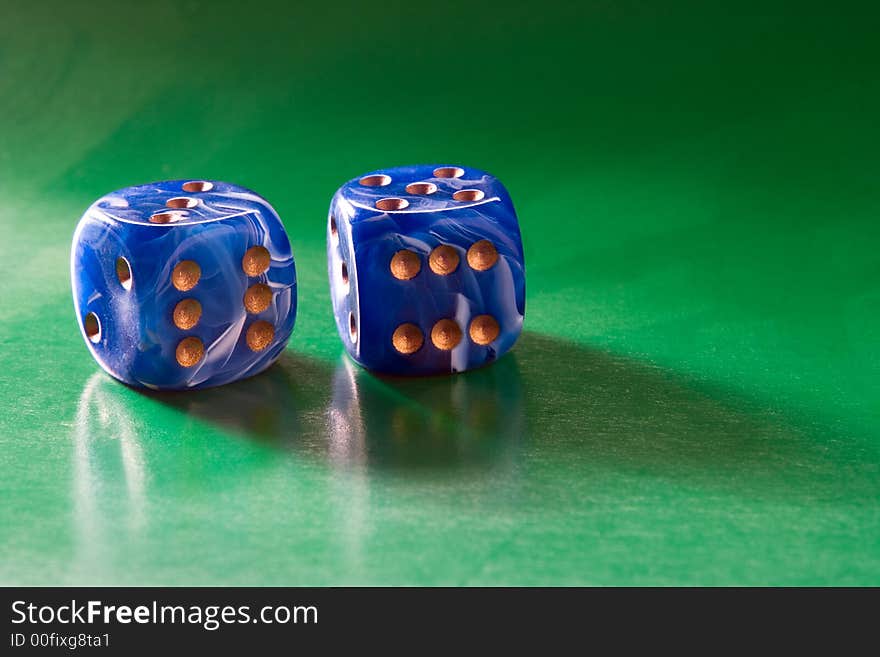 Two blue dices on green