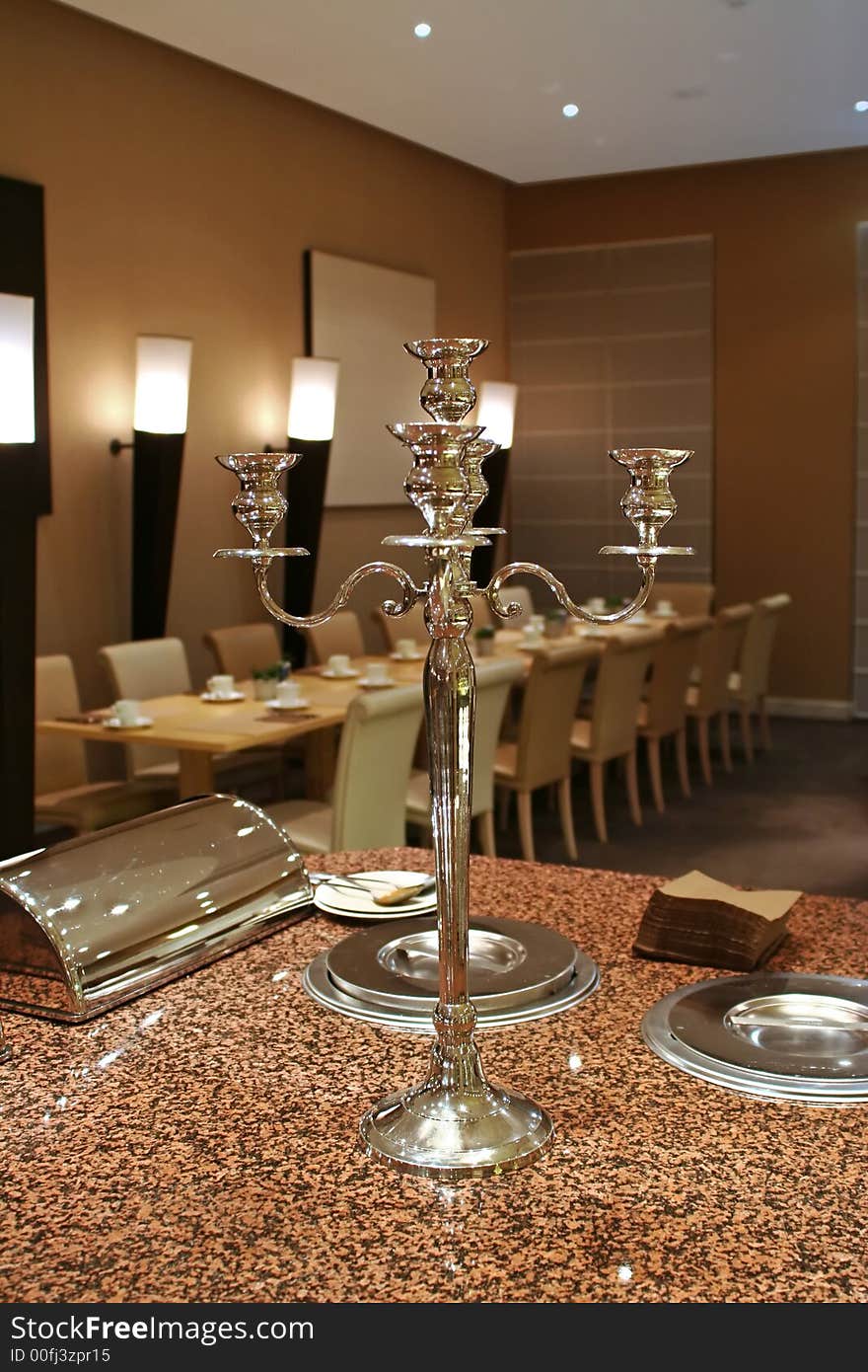 Restaurant interior with big silver candelabrum