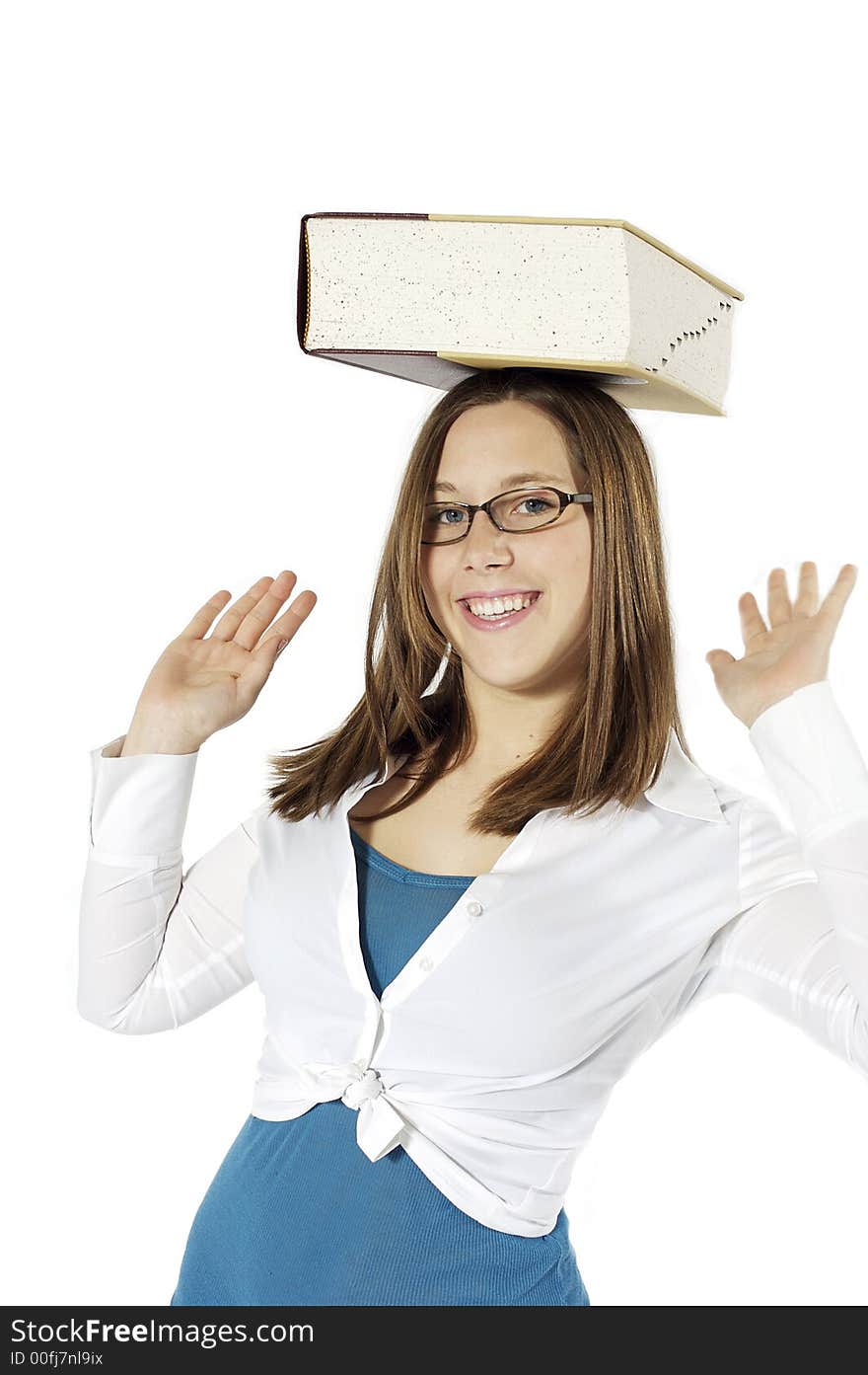 Young girl balancing a dictionary on her head. Young girl balancing a dictionary on her head