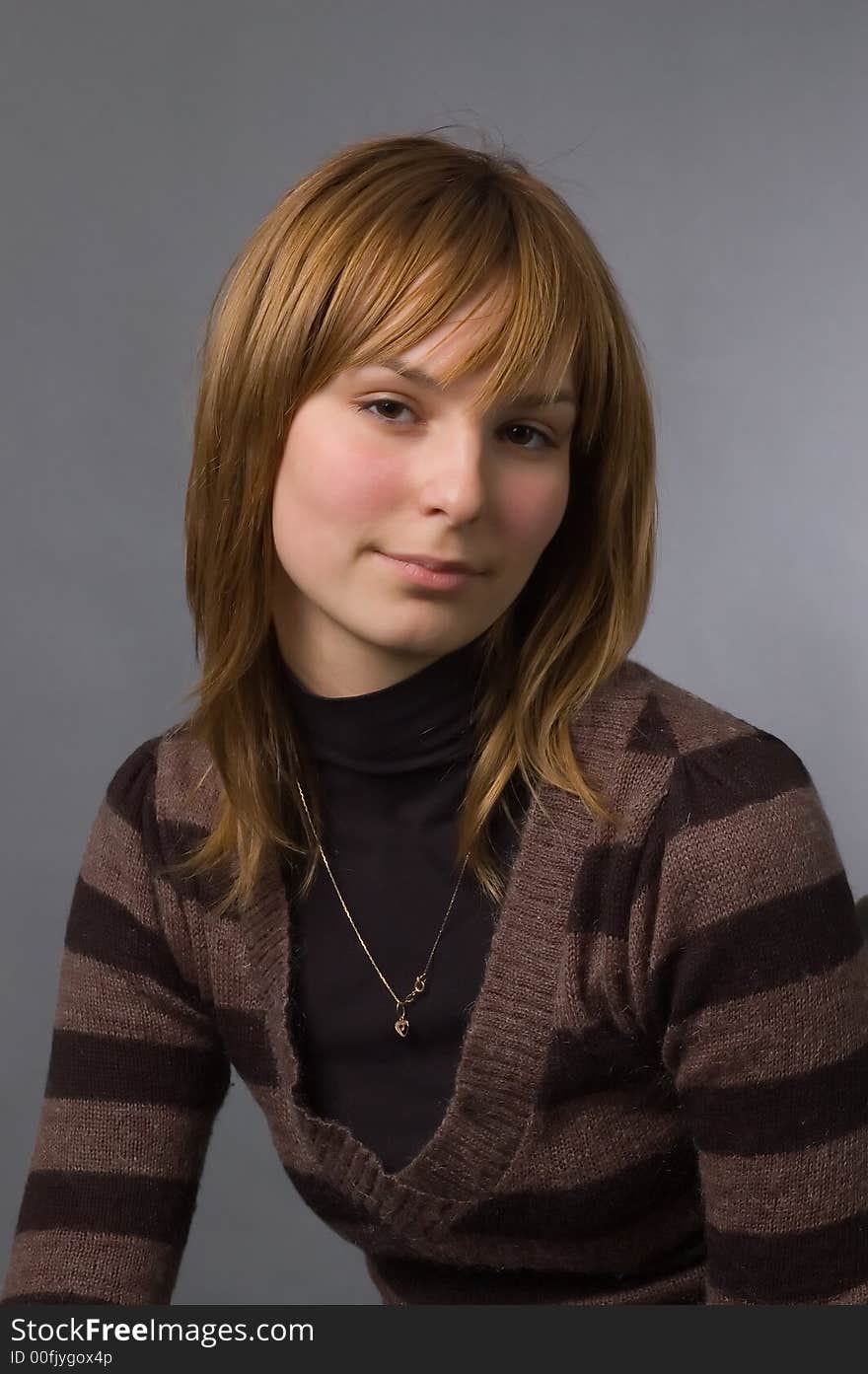 The girl with brown eyes on a grey background. The girl with brown eyes on a grey background