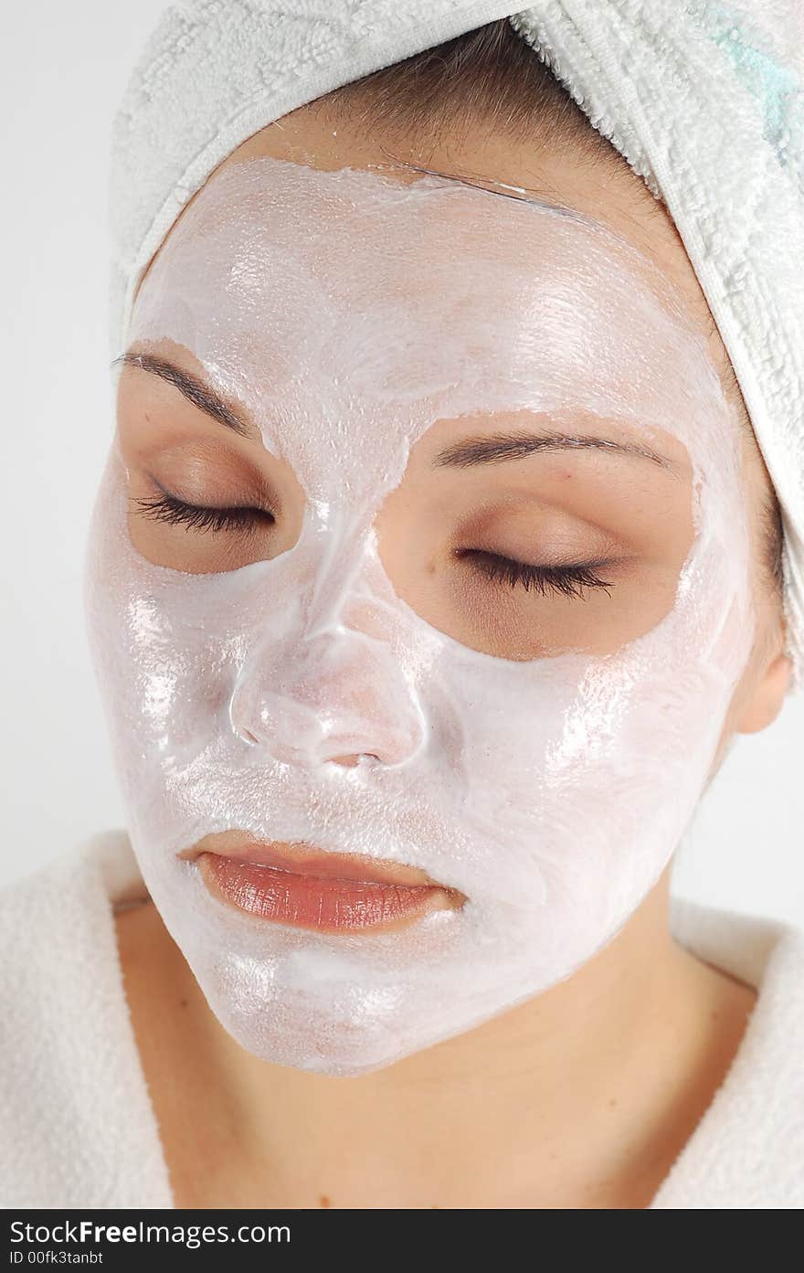 Attractive woman with facial mask on white background. Attractive woman with facial mask on white background