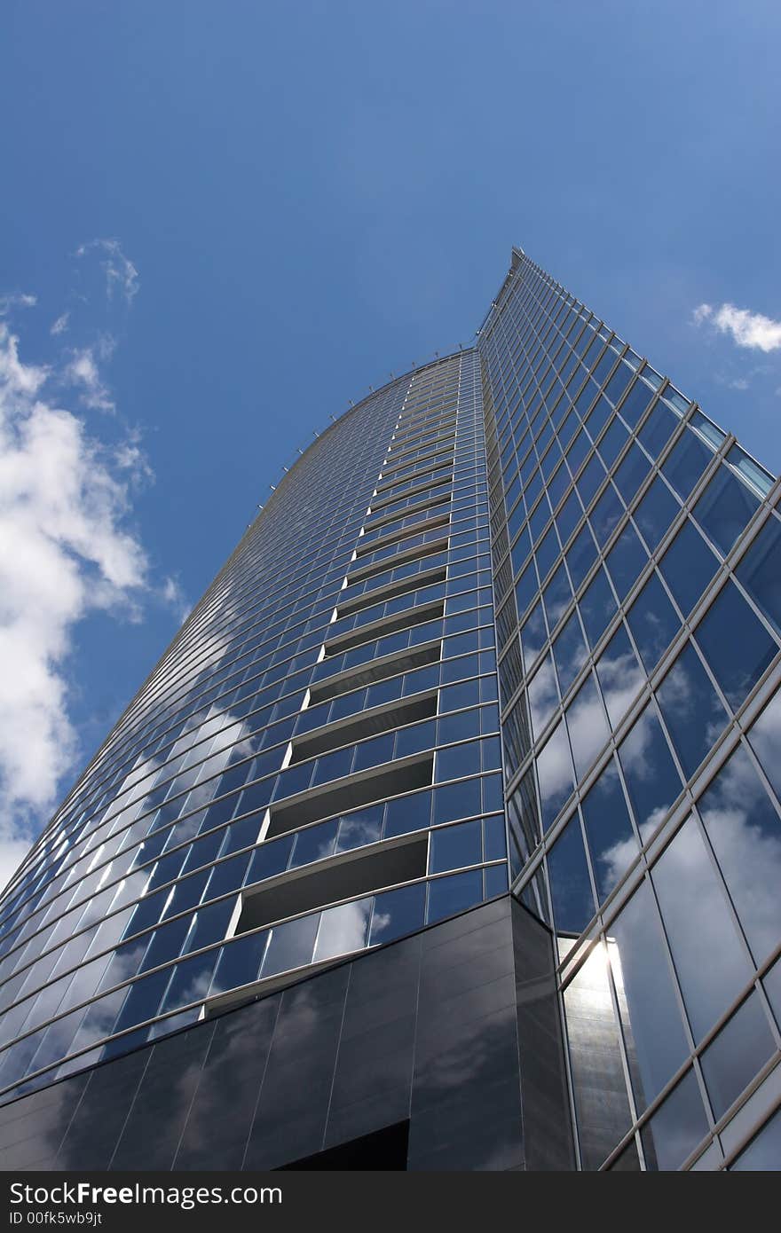 Modern office building against the cloudy sky