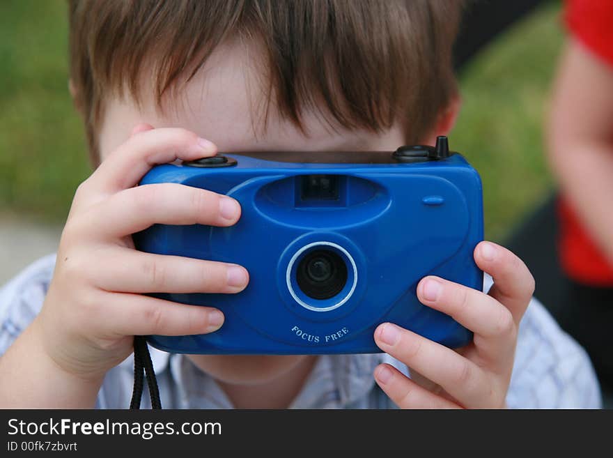 Little boy with blue camera. Little boy with blue camera