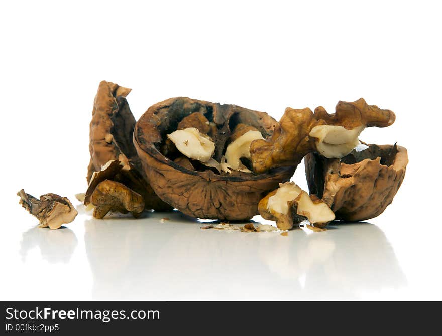 Crushed walnut over white background. Crushed walnut over white background