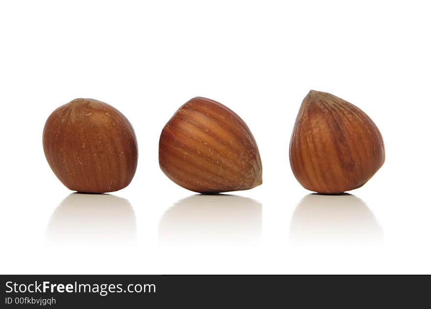 Hazelnuts isolated over white background