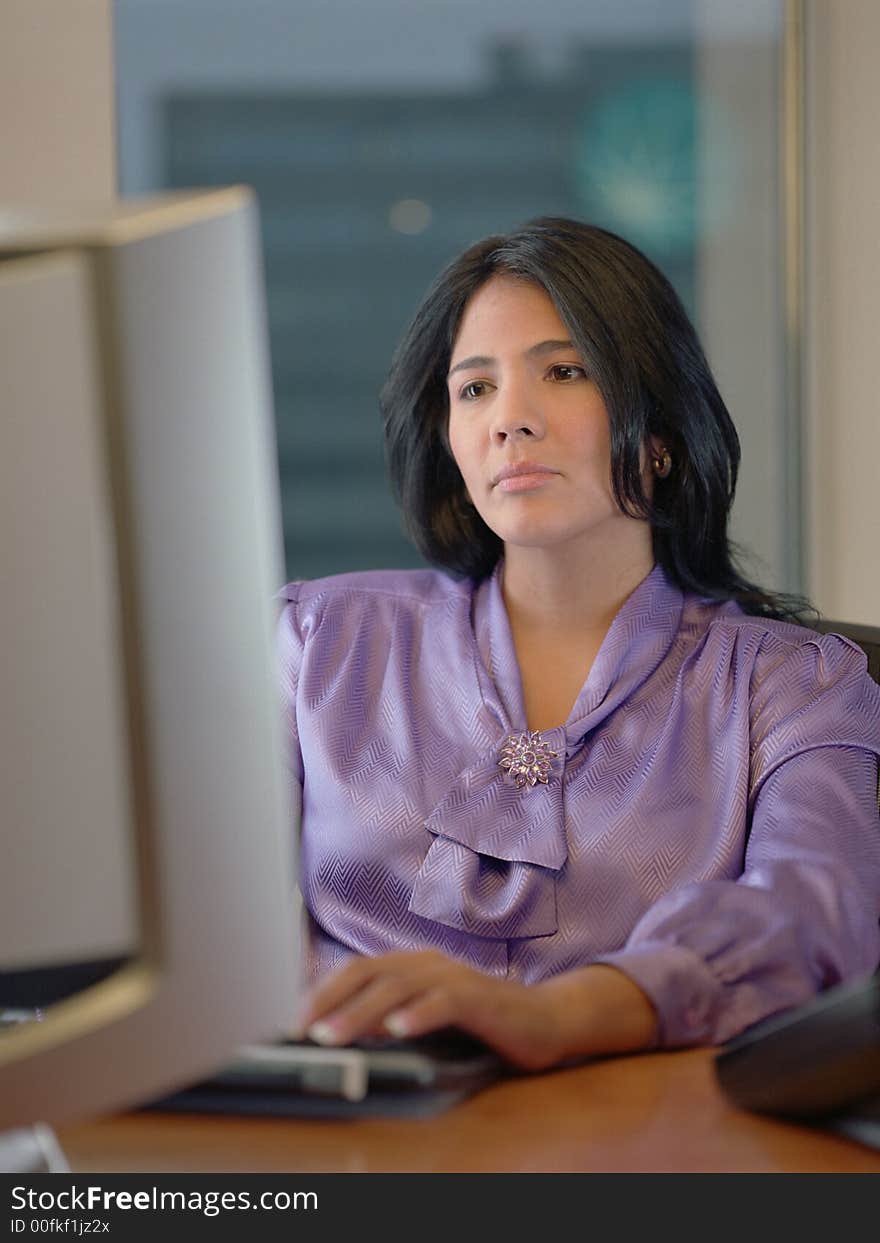 Portrait of businesswoman at her desk. Portrait of businesswoman at her desk