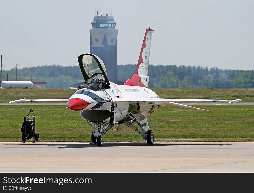 A fighter performed at a air show. A fighter performed at a air show