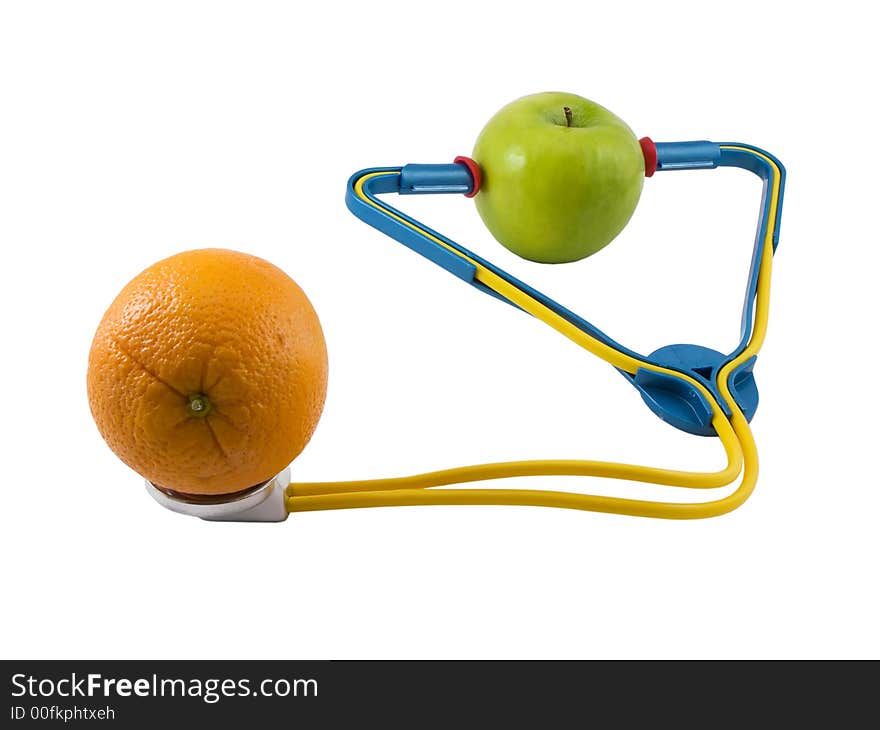 Photo of a apple wearing a stethoscope, checking an orange, isolated on white. Photo of a apple wearing a stethoscope, checking an orange, isolated on white