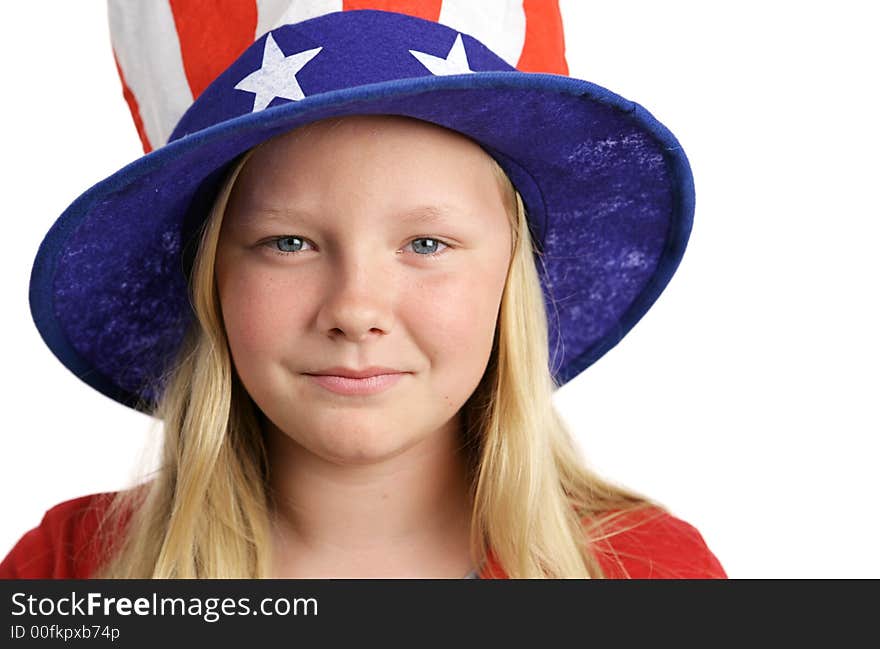 Portrait of a beautiful young American girl wearing a patriotic hat. Isolated on white. Portrait of a beautiful young American girl wearing a patriotic hat. Isolated on white.