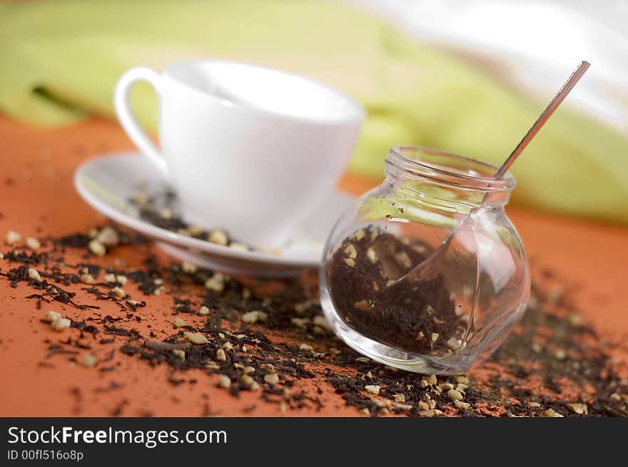 Tea and white cup on the orange background. Tea and white cup on the orange background