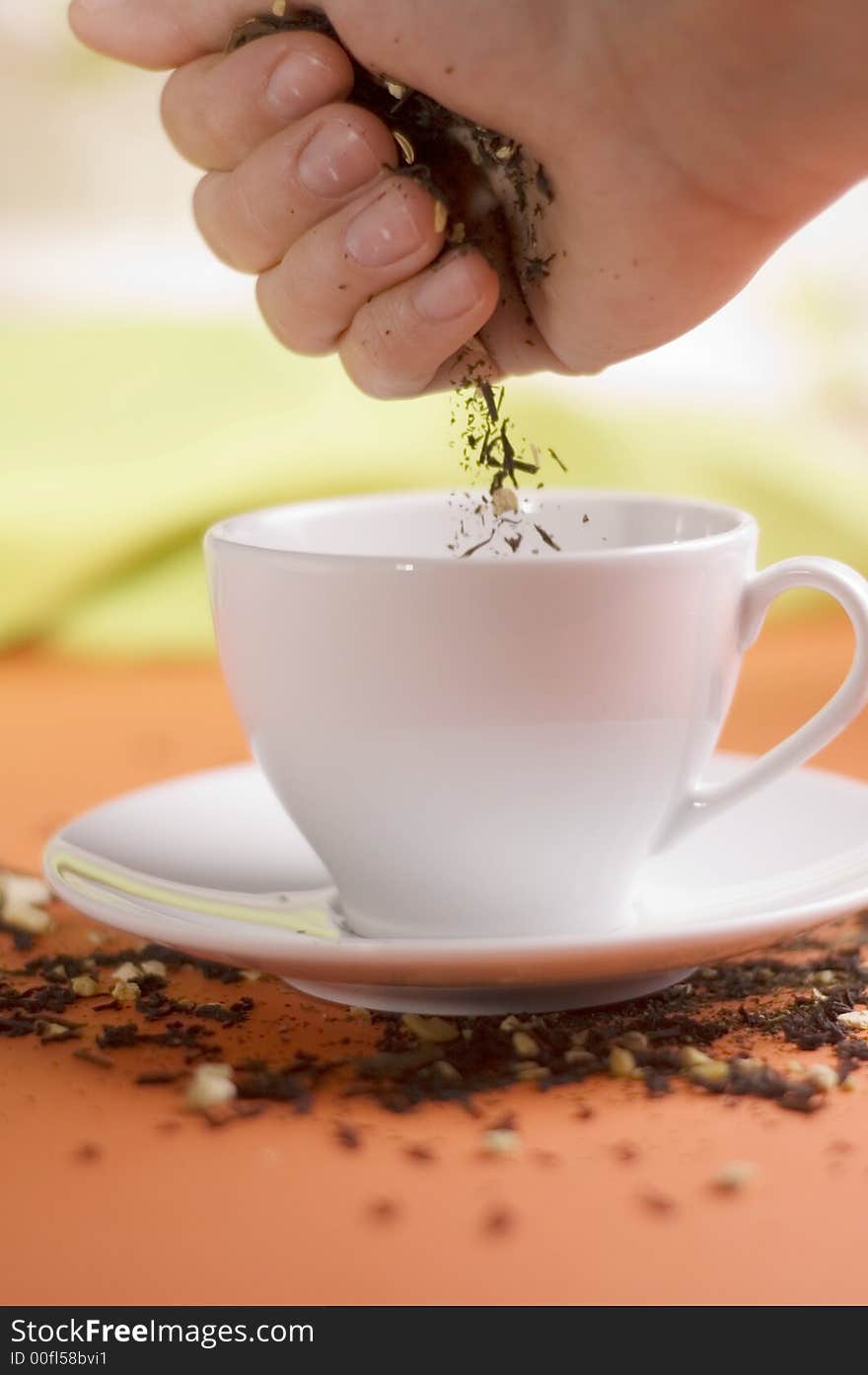 Tea and white cup on the orange background. Tea and white cup on the orange background