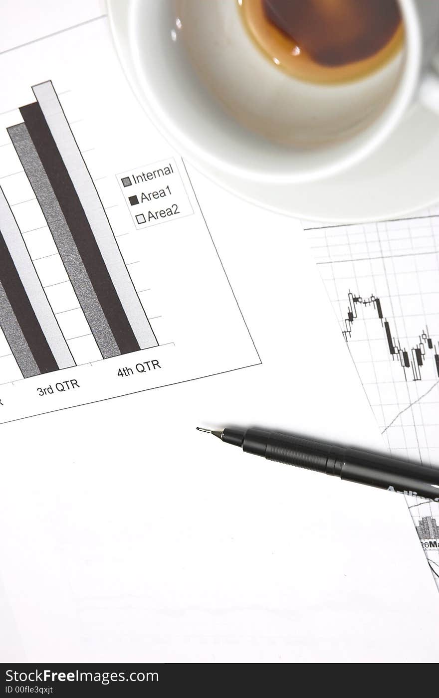 Business still life with chart showing performance over quarterly financial periods. Business still life with chart showing performance over quarterly financial periods.