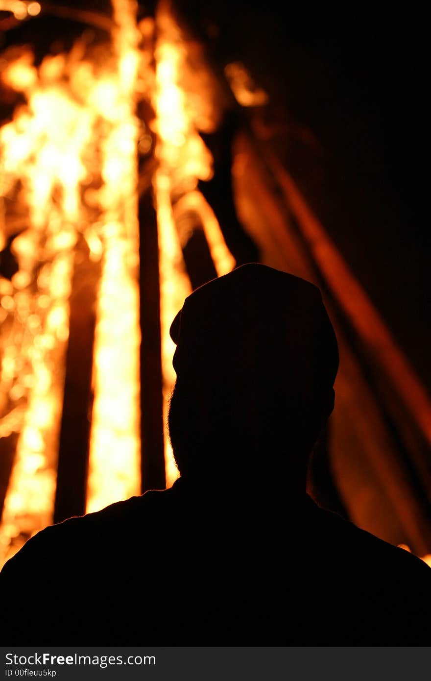 Silhouette of person near bonfire hot. Silhouette of person near bonfire hot