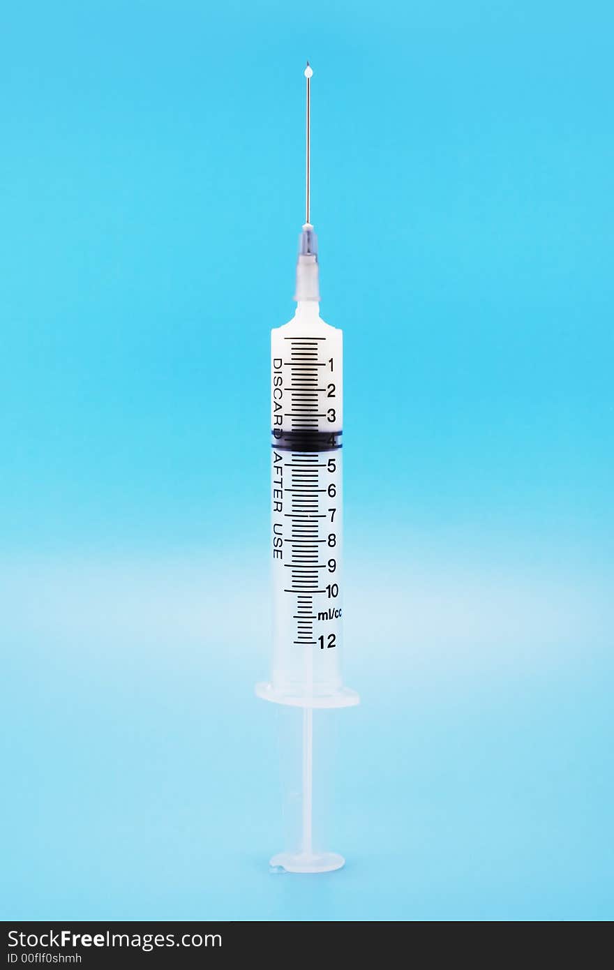 12 ml/cc syringe with chemical on a blue background