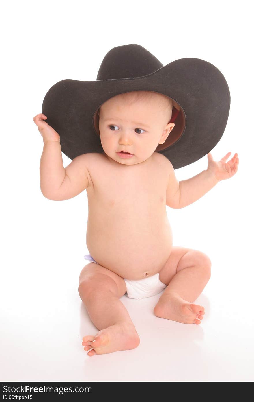 Baby in black felt hat curious. Baby in black felt hat curious