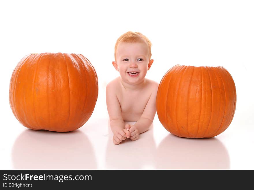 Redhead between two pumpkins