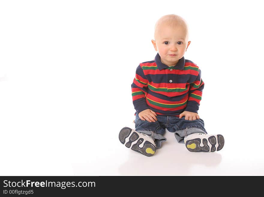 Sitting happy child isolated red. Sitting happy child isolated red