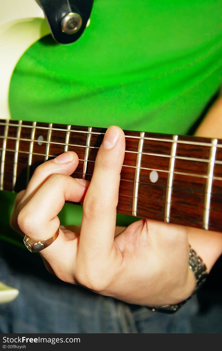 Fingers of guitar player (shallow dof)