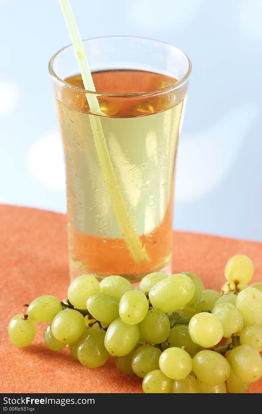 Glass of grape juice with straw. Glass of grape juice with straw