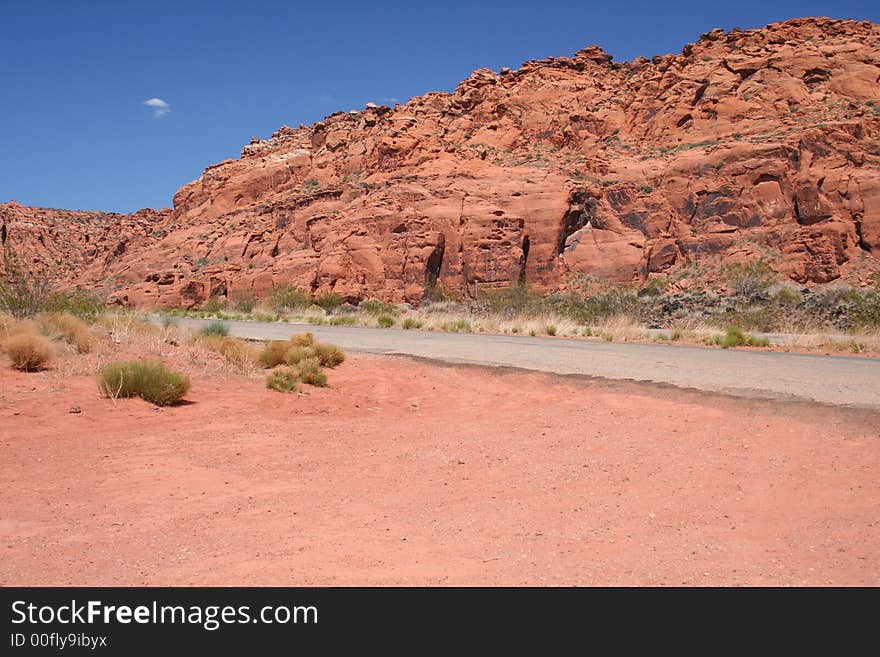 Red rock canyon against a bright blue sky. Open spaces, room for text. Red rock canyon against a bright blue sky. Open spaces, room for text.