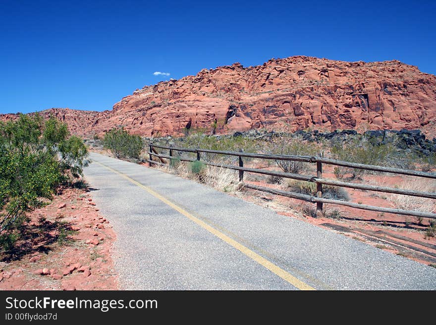 Old highway going through a red rock canyon. Old highway going through a red rock canyon.