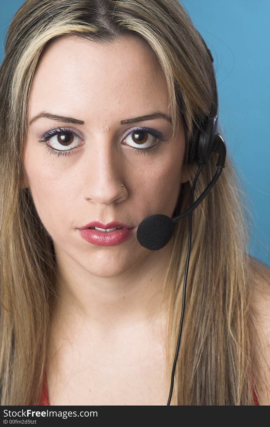 Portrait of receptionist with headset over blue drop