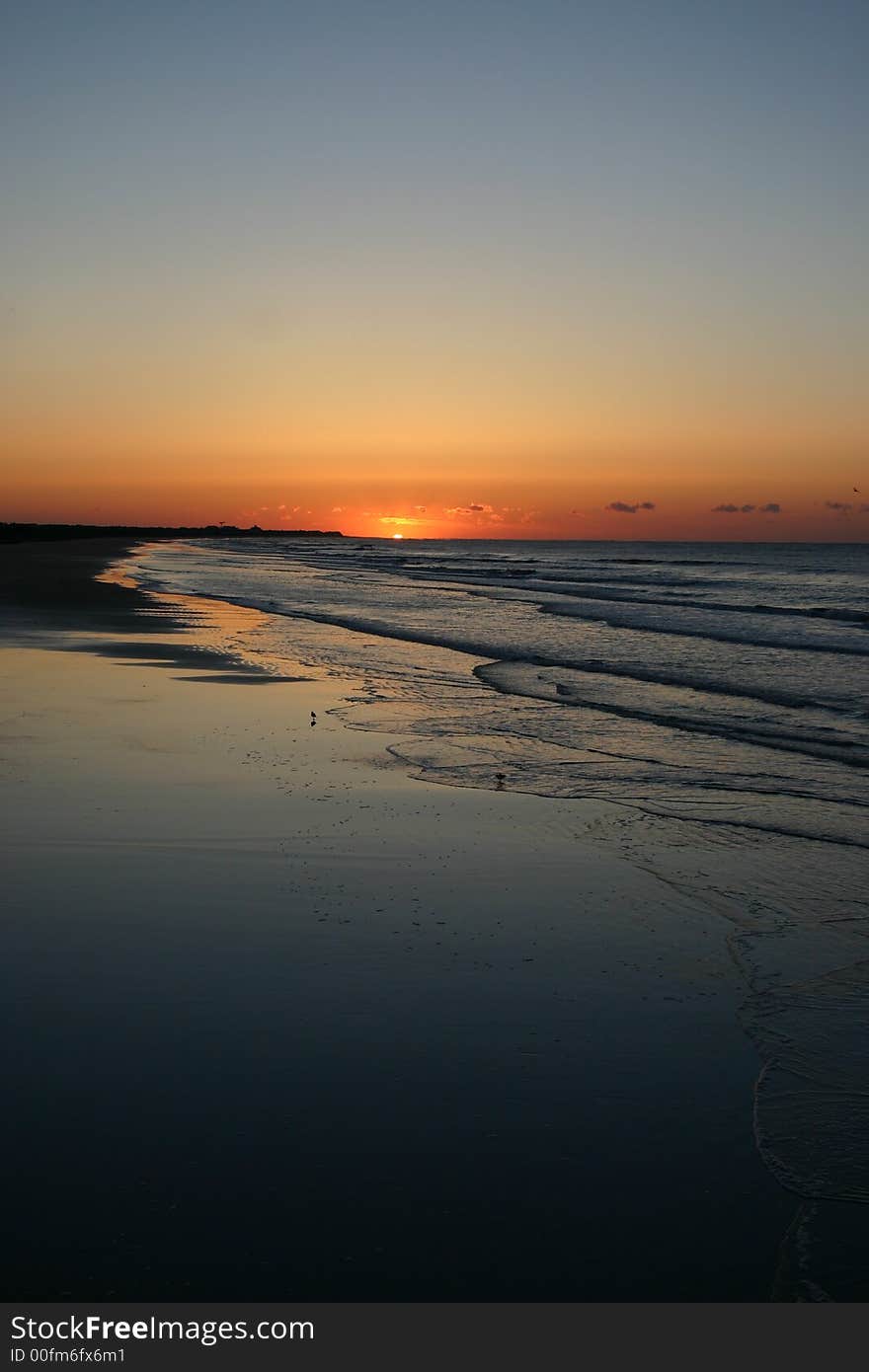 The sun rising over the Atlantic Ocean off of Isle of Palms, SC. The sun rising over the Atlantic Ocean off of Isle of Palms, SC.