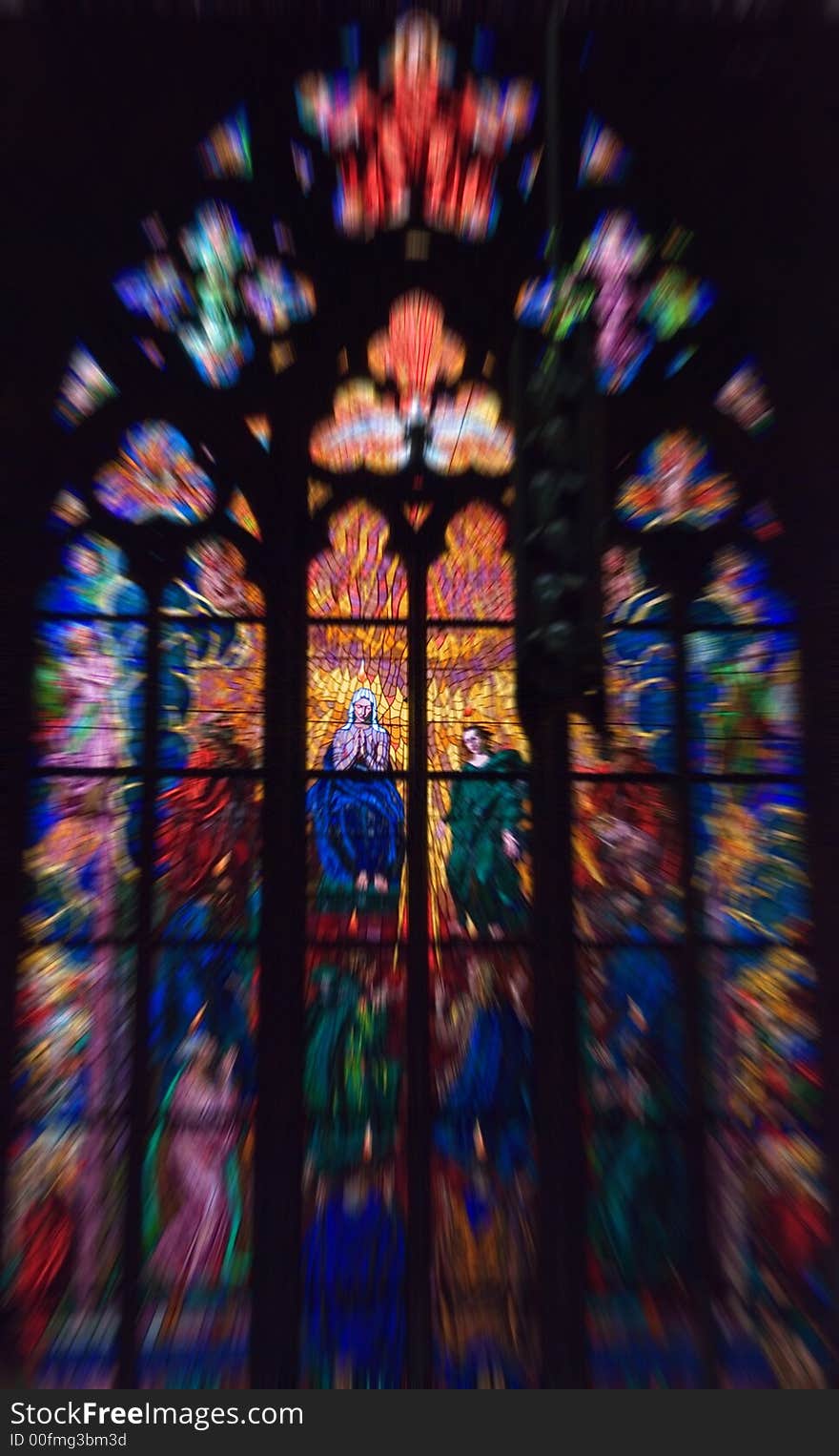 Stained window from St Vitus church in castle town , Prague Chech. with radial blur effect. Stained window from St Vitus church in castle town , Prague Chech. with radial blur effect.