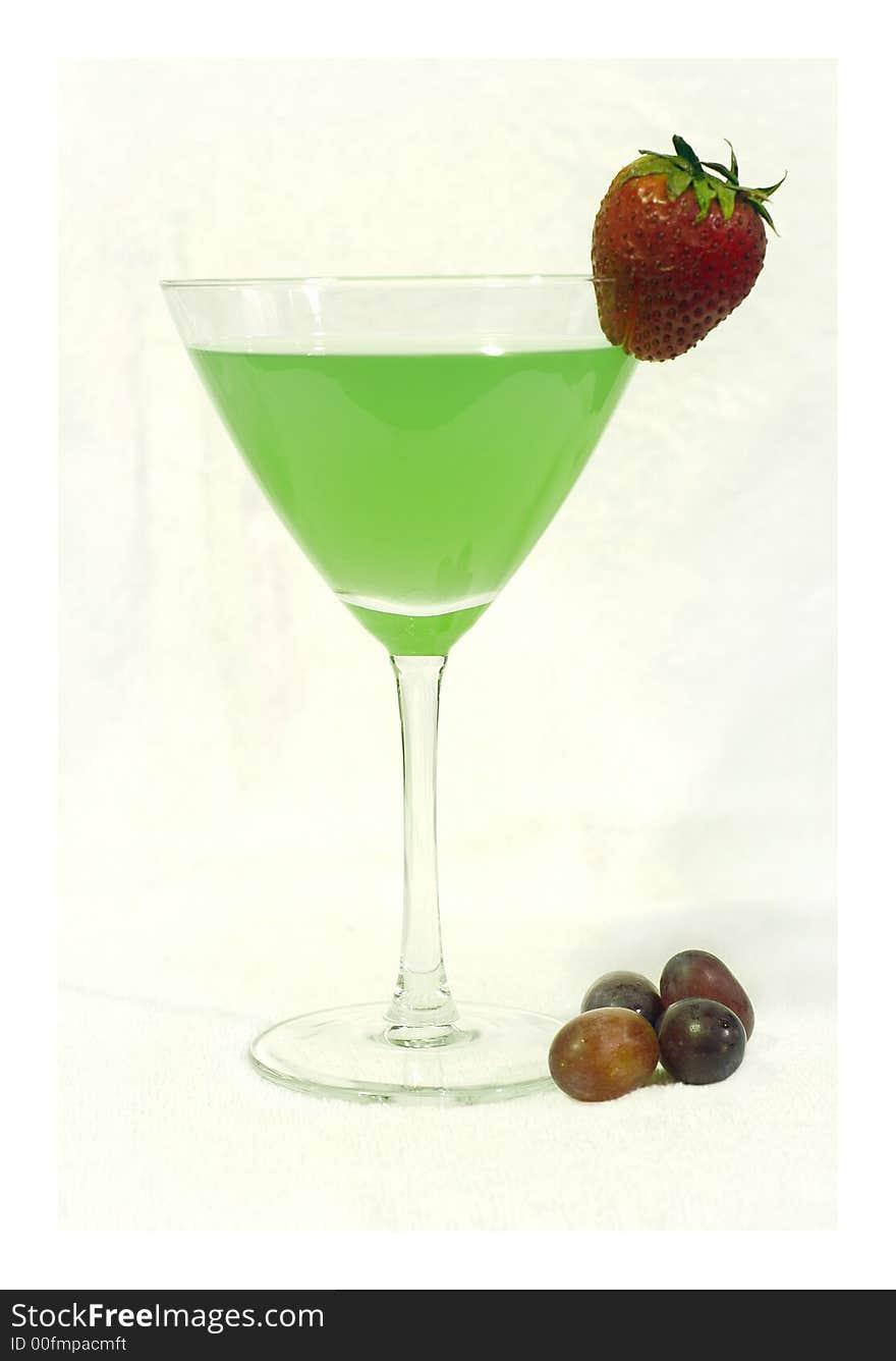 Green cocktail with strawberry