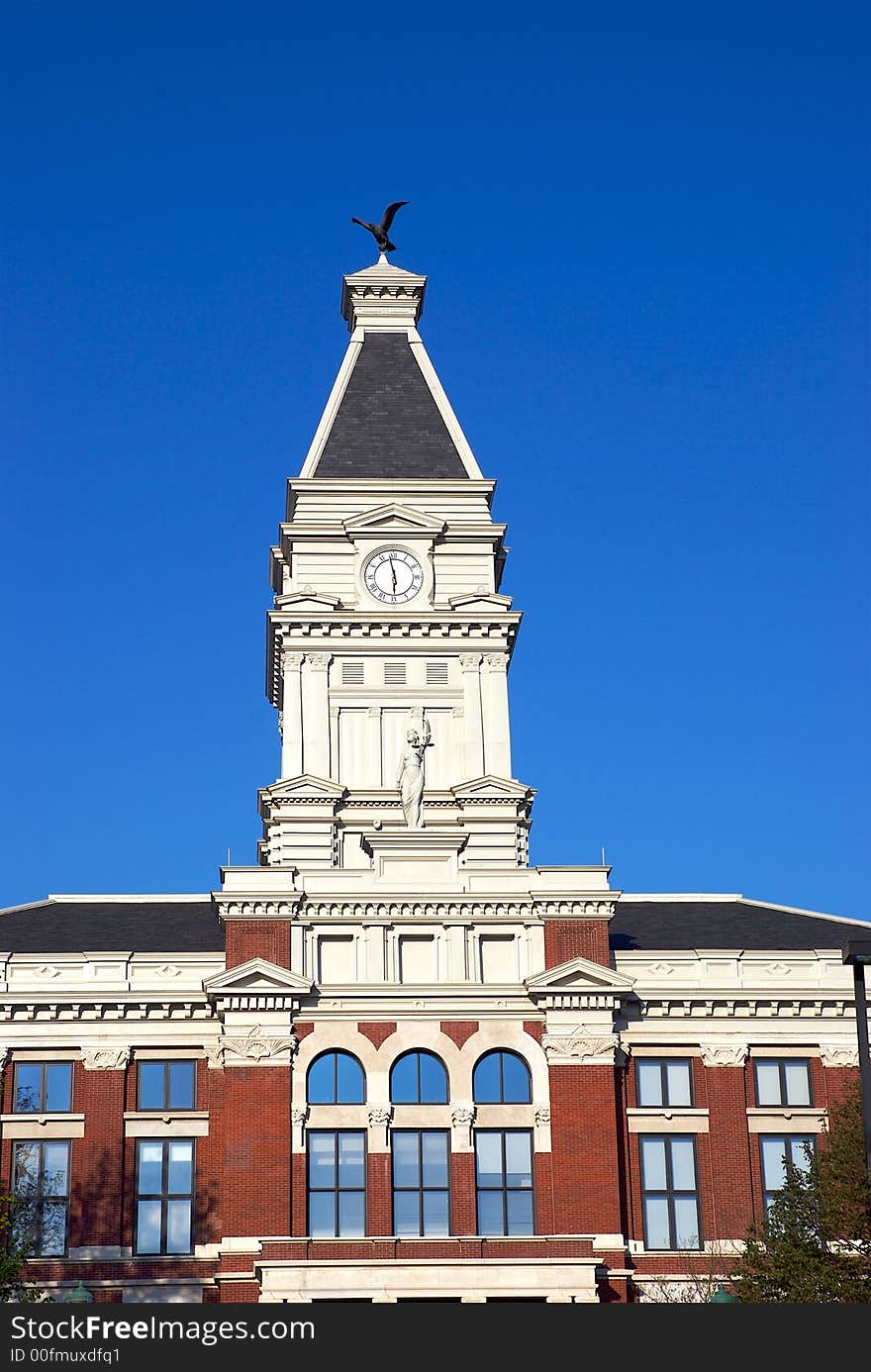 A building and a tall clock tower