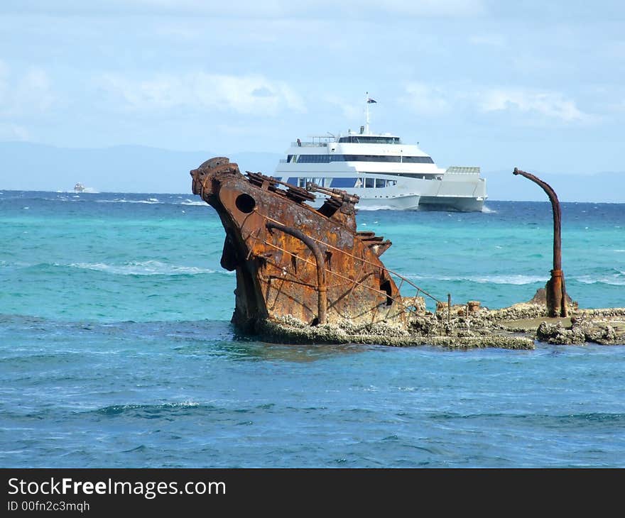 Barge sailing pass shipwrecks at Morton island