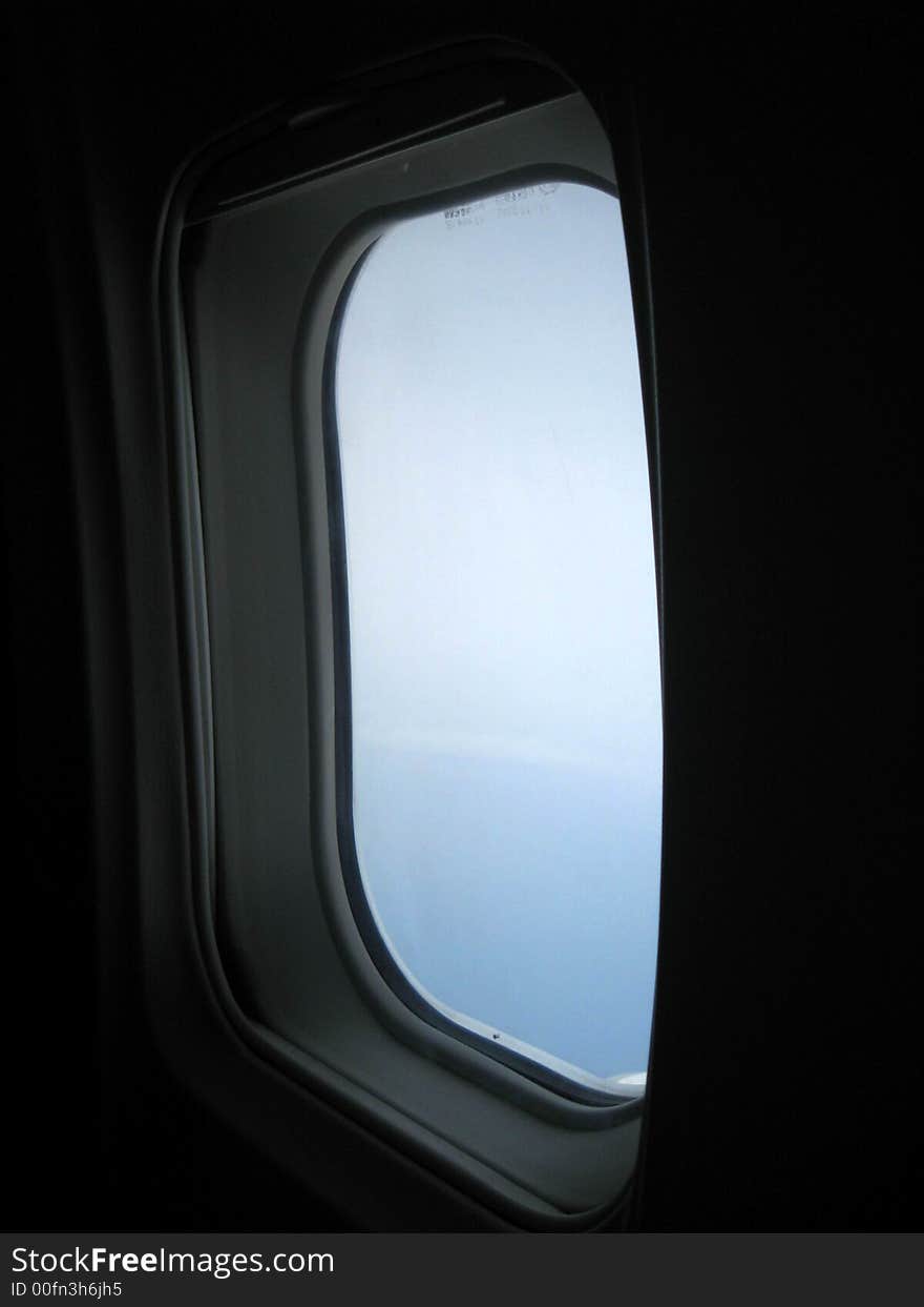 Looking outside the window of a plane. Looking outside the window of a plane