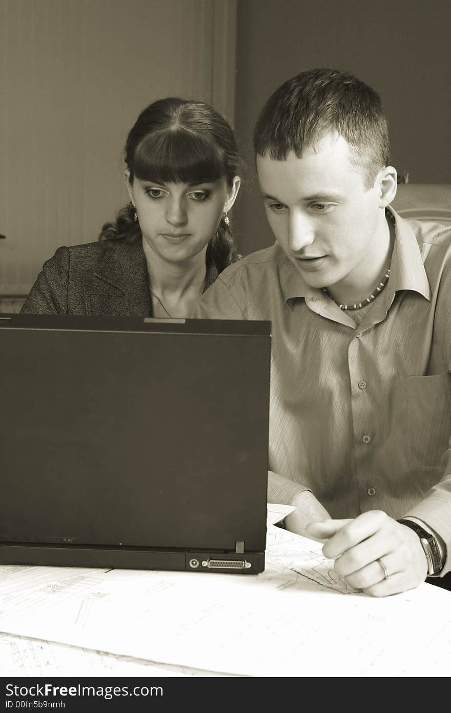 Group of business people working together in the office. Group of business people working together in the office.