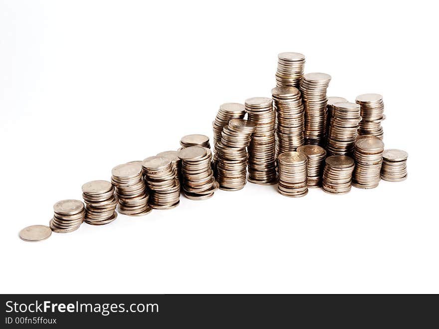 Increasing pyramid of small coins on a white background. Increasing pyramid of small coins on a white background