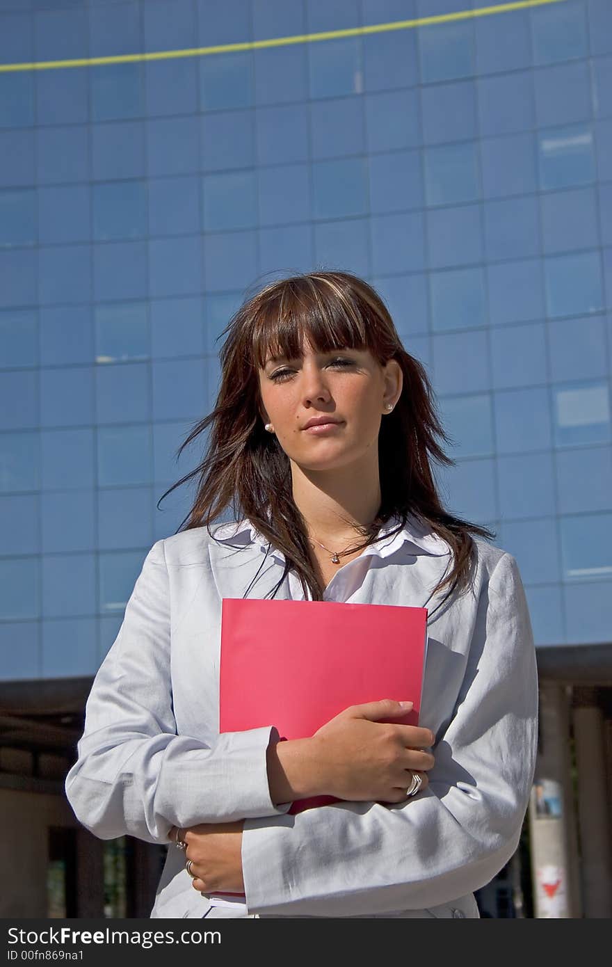 Businesswoman downtown holding a file