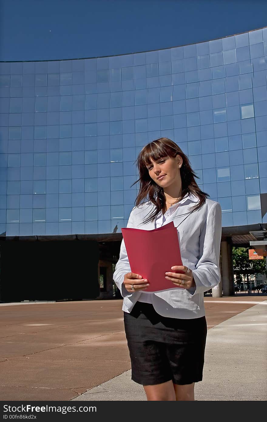 Businesswoman downtown holding a file