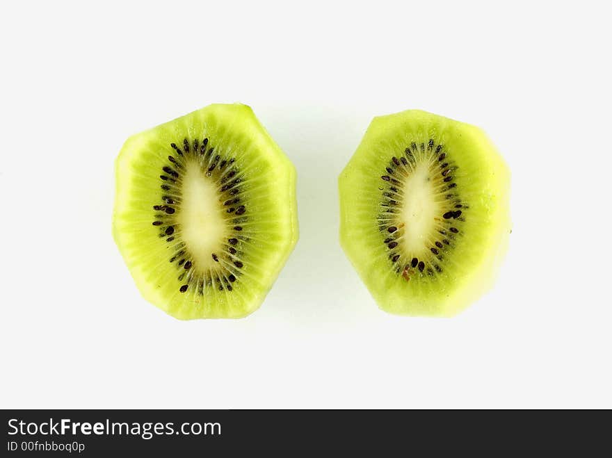 Two Kiwi fruit segments on a white background